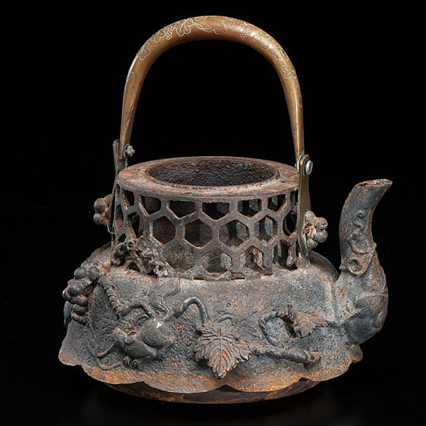 Japanese Iron Tetsubin Teapot : Japanese Iron Tetsubin Teapot Japanese, late 19th-early 20th century. A cast iron Tetsubin ceremonial teapot with animal and berry motifs, having a swing handle. Ht. 6 in. (without handle).