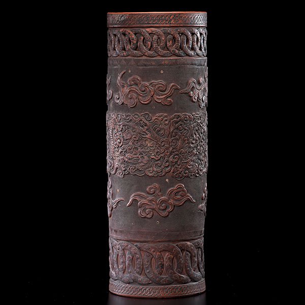 Chinese Terra Cotta Umbrella Stand : Chinese Terra Cotta Umbrella Stand Chinese, 20th century. A terra cotta umbrella stand of cylindrical form with overall carved and raised decoration on a stippled group, the top with a border of pie
