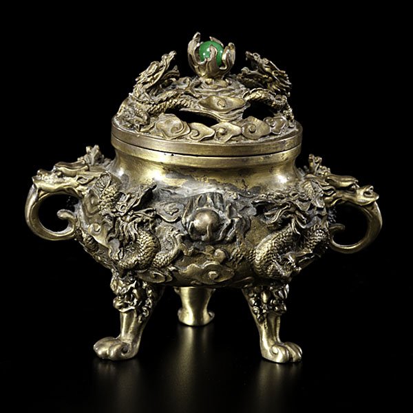 Chinese Brass Censer : Chinese Brass Censer Chinese, 20th century. A finely cast bronze incense burner with circling dragons, flame atop with jadeite ball enclosed. Marked underside; ht. 6.5 in.