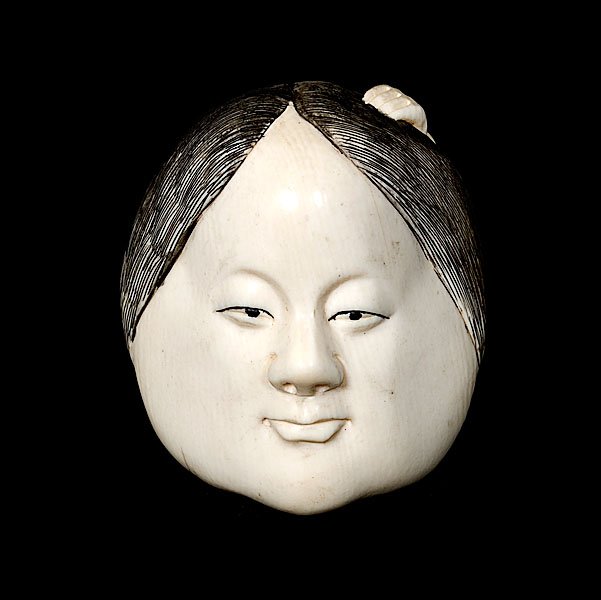 Ivory Netsuke with Carvings of a Face and of a Man : Ivory Netsuke with Carvings of a Face and of a Man Japanese, late 19th century. Inked ivory Netsuke showing a carving of a face on one side, and a carving a squatting man on the other side. Ht.: 2 i