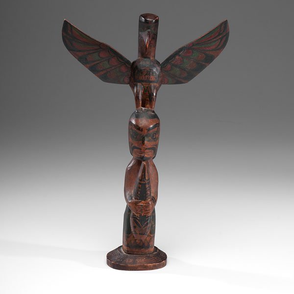 Charlie James (Kwakwaka'wakw, 1867-1938) Polychrome: Charlie James (Kwakwaka'wakw, 1867-1938) Polychrome Totem Pole two-figure totem carved with a warrior holding a fish and topped by a thunderbird; painted in red, green, and black; signed at base, he