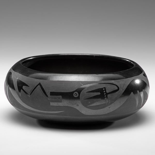 Maria (1887-1980) and Santana (1909-2002) Martinez San: Maria (1887-1980) and Santana (1909-2002) Martinez San Ildefonso Blackware Bowl of squat form and decorated with Avanyu undulating around the belly of the bowl; signed on base, height 3.25 in. x dia