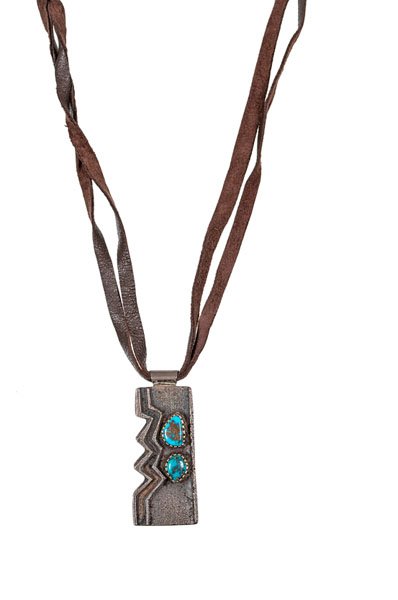 Larry Golsh (Pala Mission, 21st century) Tufa Cast: Larry Golsh (Pala Mission, 21st century) Tufa Cast Silver and Turquoise Necklace thick rectangular pendant with one side taking an organic form; set with two turquoise cabochons; hallmarked on rever