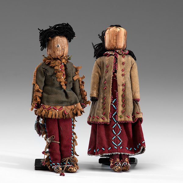 Iroquois Corn Husk Doll Family : Iroquois Corn Husk Doll Family male and female dolls composed of cornhusk and wood bodies; each doll is dressed in red and green wool clothing detailed with white, red white-heart, and light blue be