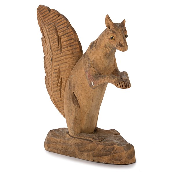 Carved Folk Art Squirrel : Carved Folk Art Squirrel American,late 19th- 20th century. A folk art carved figure in wood of a standing squirrel with beaded eyes, on base; ht. 8 in. Provenance: From the Estate of Kenneth E