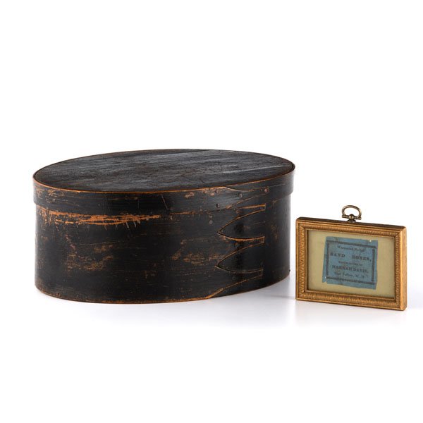 Shaker Pantry Box in Black Paint : Shaker Pantry Box in Black Paint American, 19th century. An oval pantry box, nailed construction. Consistent original black finish; ht. 4.5 in., lg. 10.25 in. Together with a framed label from�