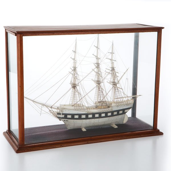 Model "Prisoner of War" Ship in Whalebone : Model "Prisoner of War" Ship in Whalebone Continental, 19th century. A three-masted model ship in whalebone with complete rigging in string and black painted hull, in wood frame glass case; case ht.