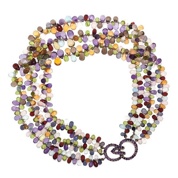 Mish of New York Jeweled Clasp Semi-Precious Necklace : A triple strand necklace of semi-precious briolettes consisting of amethyst, garnet, rose quartz, iolite, blue topaz and peridot. The clasp is an 18 karat white gold hook-and-eye closure set with roun