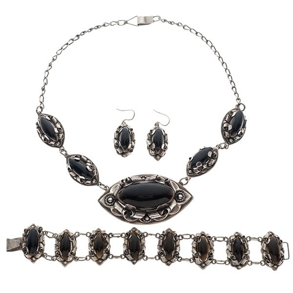Sterling and Obsidian Ensemble Made in Mexico : A four-piece ensemble consisting of a pair of earrings with two 18.5mm x 8.5mm marquise-shaped obsidian, a 7 in. bracelet with eight 18.5mm x 8.5mm marquise-shaped obsidian and a 17 in. necklace with