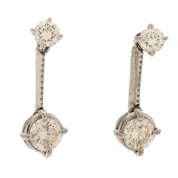 Roberto Coin Diamond Dangle Earrings : One pair of 14k white gold Roberto Coin dangling studs containing two VS1, H-color round brilliant diamonds weighing approximately .40 carats total weight and 2 VS1, H-color round brilliant diamonds w
