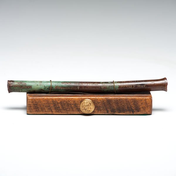 USS Hartford, Copper Pin Relic : Copper pin relic, 10.25 in. long, .75 in. dia., stamped: 1858/ USS Hartford/ New Orleans/ Vicksburg/ Mobile Bay/ Farragut 1 - 28 - 62 to/ 12 - 13 - 64. Mounted with wire to wood base. Provenance: Th