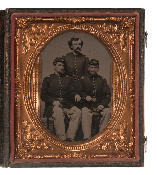 Civil War Sixth Plate Tintype of Identified Officers of: Sixth plate tintype, trimmed to 1.875 x 3.125 in., affixed on verso with a label identifying the subjects as (l-r): S. Johnson, Lt. F. Mundy and Charles Kelly / 44th NY Oct 1863. Seth F. Johnson enlis