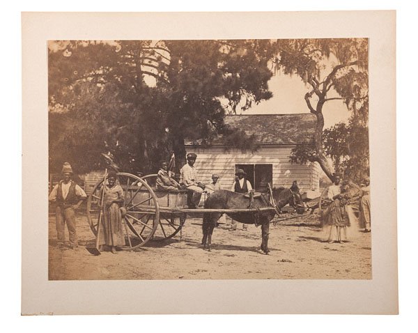 H.P. Moore Photograph of Freed Slaves, Edisto Island,: Albumen photograph, 5.25 x 7 in., mounted, 6.5 x 8 in., attributed to Henry P. Moore. Taken in the spring of 1862 on James Hopkinson's plantation, Edisto Island, SC. Concord, NH photographer Henry P. 