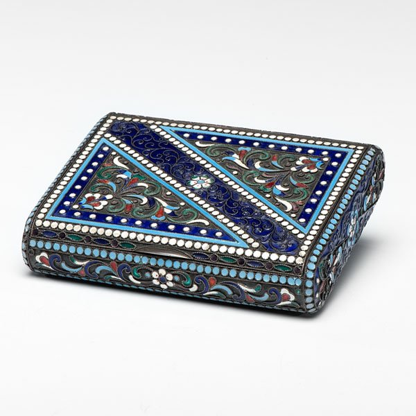 Russian Enamel and Silver Box : Russian Enamel and Silver Box Russian, 20th century. A silver and polychrome enamel hinged box of rectangular form with gilt interior, having a scrolling leaf and floral motif set within borders, ma