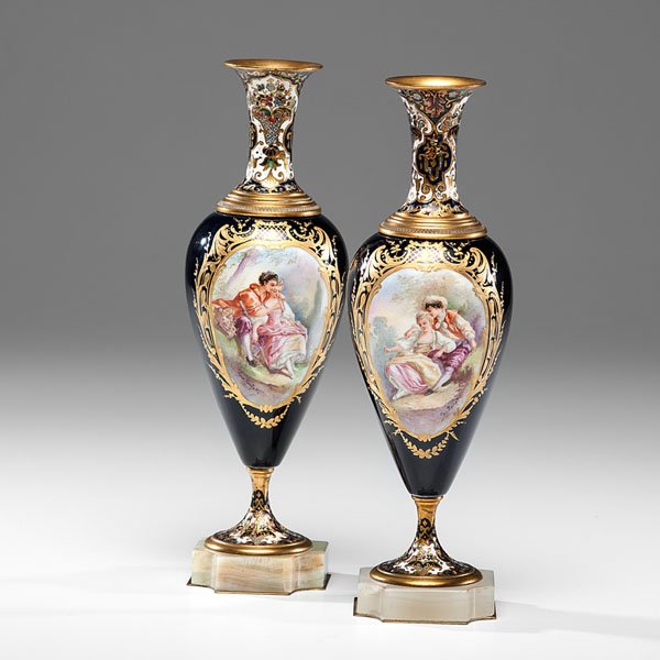Pair of Sevres-Style Champleve Vases : Pair of Sevres-Style Champleve Vases French, late 19th-early 20th century. A pair of Sevres-style porcelain and champleve vases, each with painted cartouches of lovers and a landscape framed by gilt