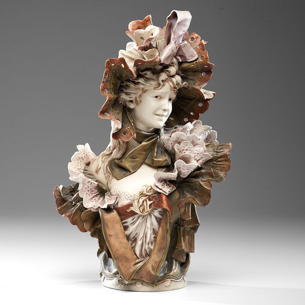 Royal Dux Bohemia Porcelain Bust of a Woman : Royal Dux Bohemia Porcelain Bust of a Woman Bohemian, late 19th century-early 20th century. An ornate and painted porcelain bust of a lady wearing a hat with ribbon and a lacy dress. Royal Dux Bohem