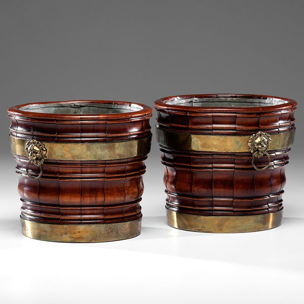 English Mahogany Brass-Bound Wine Coolers : English Mahogany Brass-Bound Wine Coolers English, 19th century. A pair of bucket-form wine coolers in mahogany, each having two brass hoops and lion mask handles, the interiors fitted with a remova