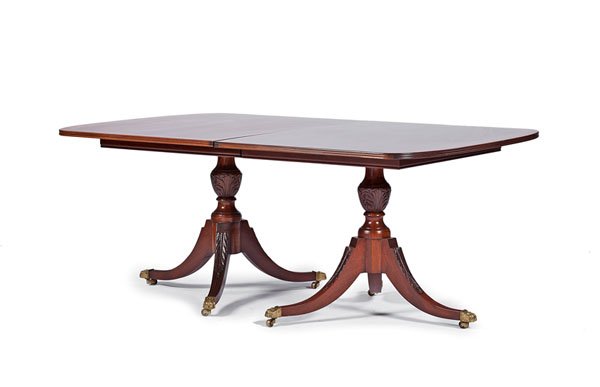 Duncan Phyfe-Style Mahogany Dining Table : Duncan Phyfe-Style Mahogany Dining Table American, 20th century. A Duncan Phyfe-style dining table with two leaves in mahogany and satinwood, the crossbanded top with rounded ends and a reeded edge