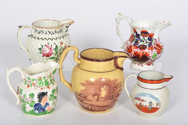 Pearlware and Creamware Pitchers : Pearlware and Creamware Pitchers English and Welsh, 19th century. An assembled group of five pearlware and creamware pitchers by various makers, including a Gaudy Dutch Grape pattern pitcher, a Prat