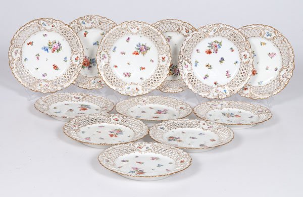 English Dessert Plates : English Dessert Plates English, late 19th- to early 20th century. A set of 12 reticulated and gilt hand-painted dessert plates, possibly Minton. The rococo decoration of arching c-scrolls over re