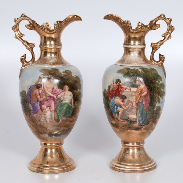 Pair of Ewers with Gilt Handes : Pair of Ewers with Gilt Handes England, early 20th century. Two ceramic ewers with gilt handles, mouths, and bases, and decorated with hand-painted lyrical and bucolic scenes. A. G. Harley Jones (Fe