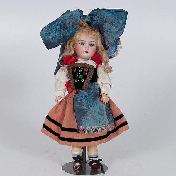 German Bisque Head Doll : German Bisque Head Doll German, ca 1901. A bisque head doll by Armand Marseille with jointed composition body and glass sleep eyes, wearing Alsatian costume of a World War I-era school girl and mark