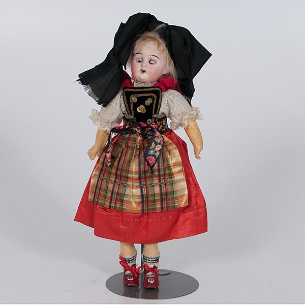 German Bisque Head Doll : German Bisque Head Doll German, early 20th century. A bisque head doll with jointed composition body in original wig and Alsatian costume, including socks, shoes and undergarments, marked PR 1900 (P