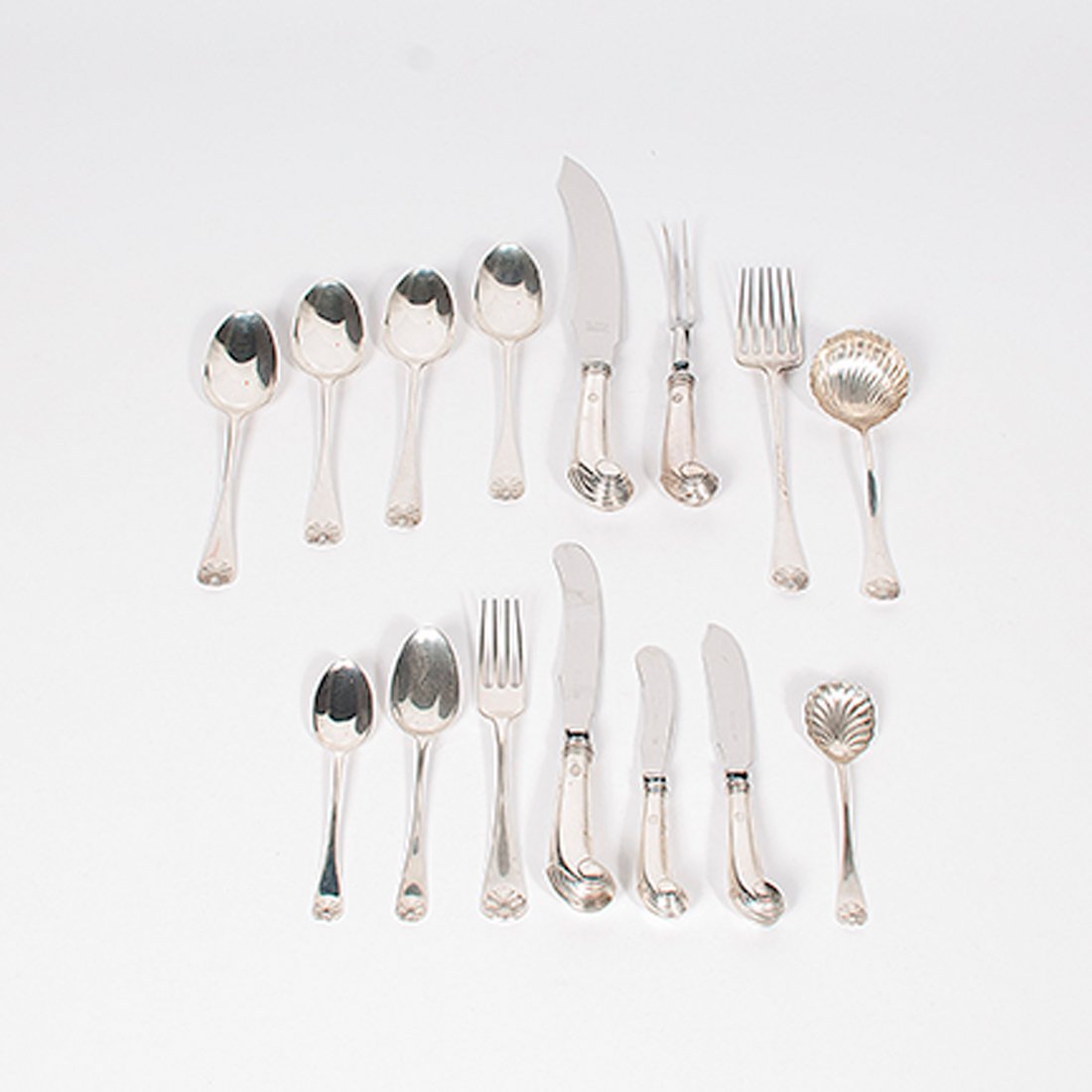 Stieff Sterling Flatware : Stieff Sterling Flatware American, ca 1970s. A flatware set for twelve in the Williamsburg Shell pattern comprised of dinner forks, dinner knives, a fish knife, four serving spoons, oval soup spoo