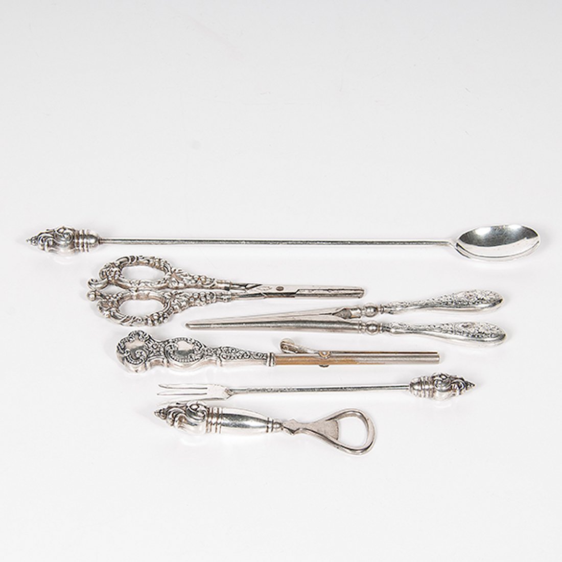 Sterling Ladies Accessories : Sterling Ladies Accessories American and German. An assembled group, including two hair crimpers with sterling handles, one pair of grape scissors with sterling handles by VOM CLEFF & Co., one bot