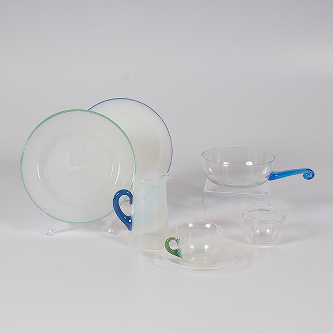 Fry Opalescent Tableware : Fry Opalescent Tableware American, 20th century. A group of glass attributed to Fry including Foval-style cup and saucer, diminutive pitcher, handled bowl, two plates and a small bowl marked for Fry