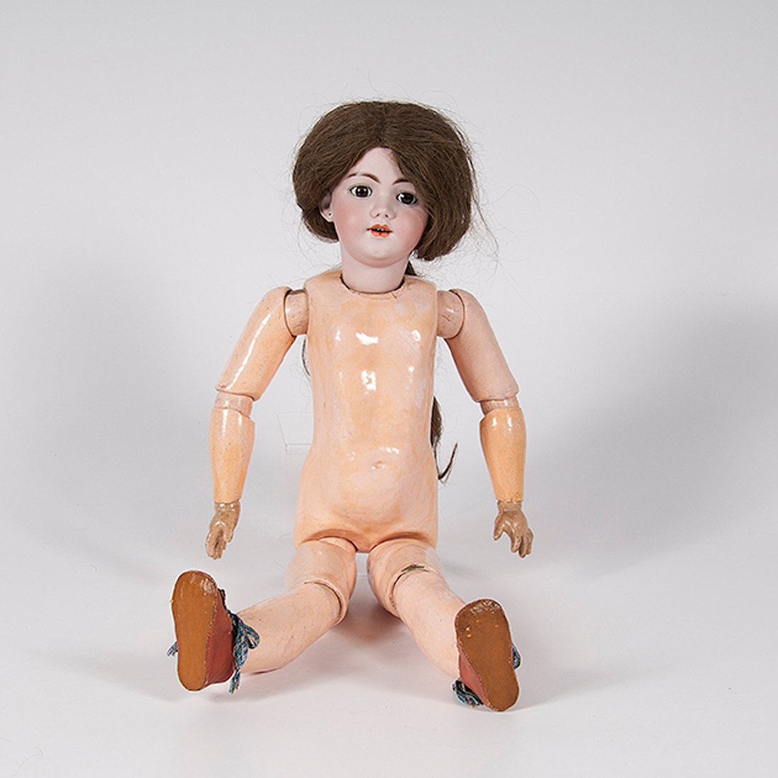Simon and Halbig 1249 Santa Bisque-Head Doll : Simon and Halbig 1249 Santa Bisque-Head Doll German. A Simon and Halbig bisque head doll with jointed composition body, brown sleep eyes and painted features, open mouth with upper teeth, pierc
