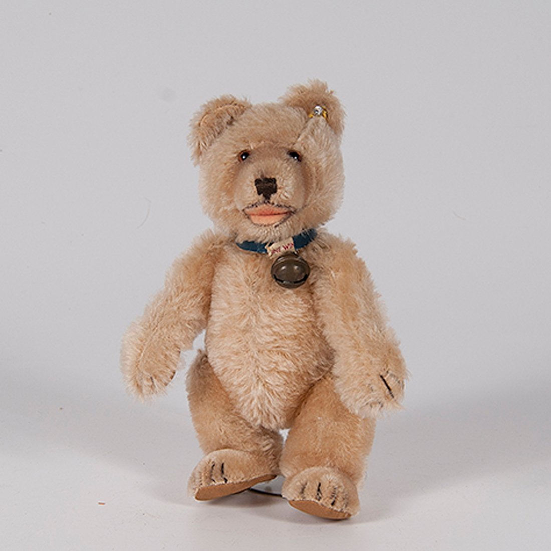 Post-War Steiff Mohair Teddy : Post-War Steiff Mohair Teddy German, early 1950s. One Steiff teddy baby, EAN 7322, ear button with Steiff in script, jointed, shorter mohair on muzzle and feet, inoperable squeaker, blue leath