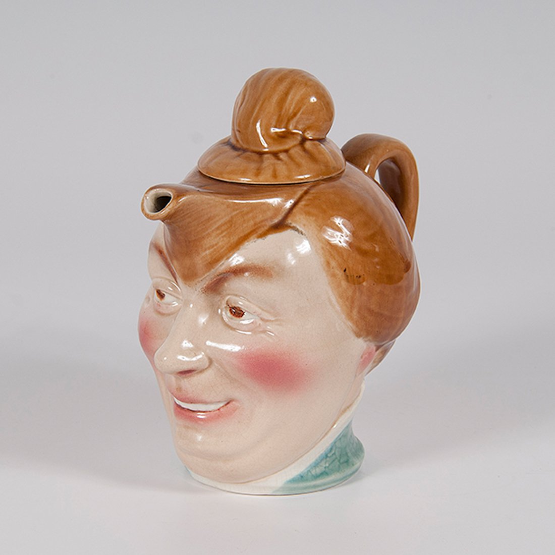 Rare Sarreguemines Figural Head Teapot : Rare Sarreguemines Figural Head Teapot French, 19th century. A rare Sarreguemines figural head teapot in the form of a woman with open-mouth smile, marked on bottom SARREGUEMINES, D3876, 227/08; h