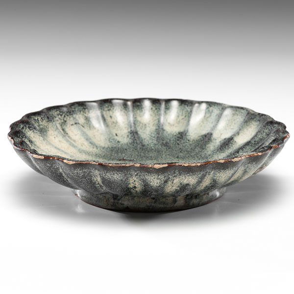 Chinese Ash-Glazed Scalloped Plate : Chinese Ash-Glazed Scalloped Plate Chinese, Ming dynasty. An earthenware footed and scalloped plate covered in an ash glaze. Impressed mark to underside; dia. 8.25 in.