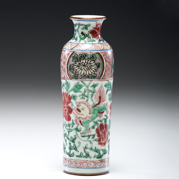 A Wucai Buddhist Lion Sleeve Vase, Transitional Period : A Wucai Buddhist Lion Sleeve Vase, Transitional Period Transitional Period. A wucai lion rare, rare form and decorated throughout body; ht. 8.25 in. Provenance: Ex Marchant & Son, London