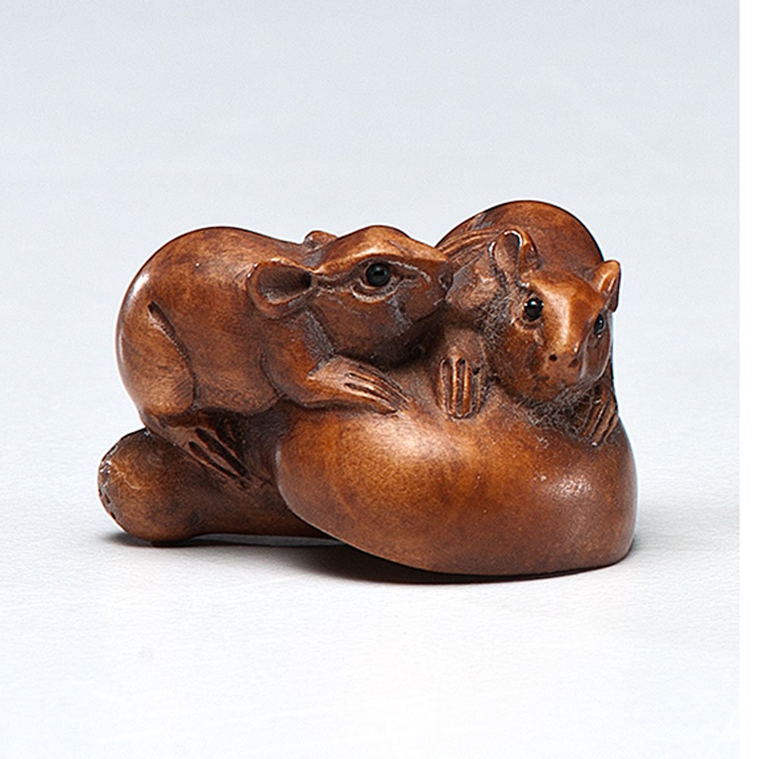 Katabori Netsuke : Katabori Netsuke Japanese, Meiji period. A Katabori netsuke of wood, carved artfully into two mice on a mushroom, signed, lg. 1 in.
