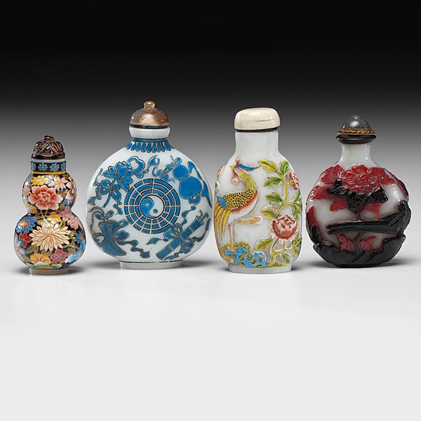 Four Polychrome Decorated Glass Snuff Bottles : Four Polychrome Decorated Glass Snuff Bottles Chinese, 20th century. A group of four glass snuff bottles decorated with relief and enamel floral and bird motifs as well as Buddhist symbols. Ht. 3.25