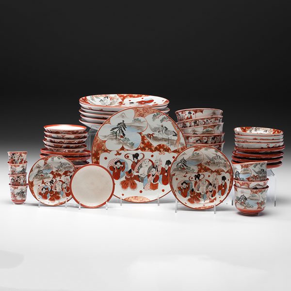 Japanese Kutani Porcelain Dinnerware Set : Japanese Kutani Porcelain Dinnerware Set Japanese, Meiji period. A Kutani dinner service decorated in red and gilt and featuring the seven Lucky Gods, cranes, and a village scene, comprising ten din