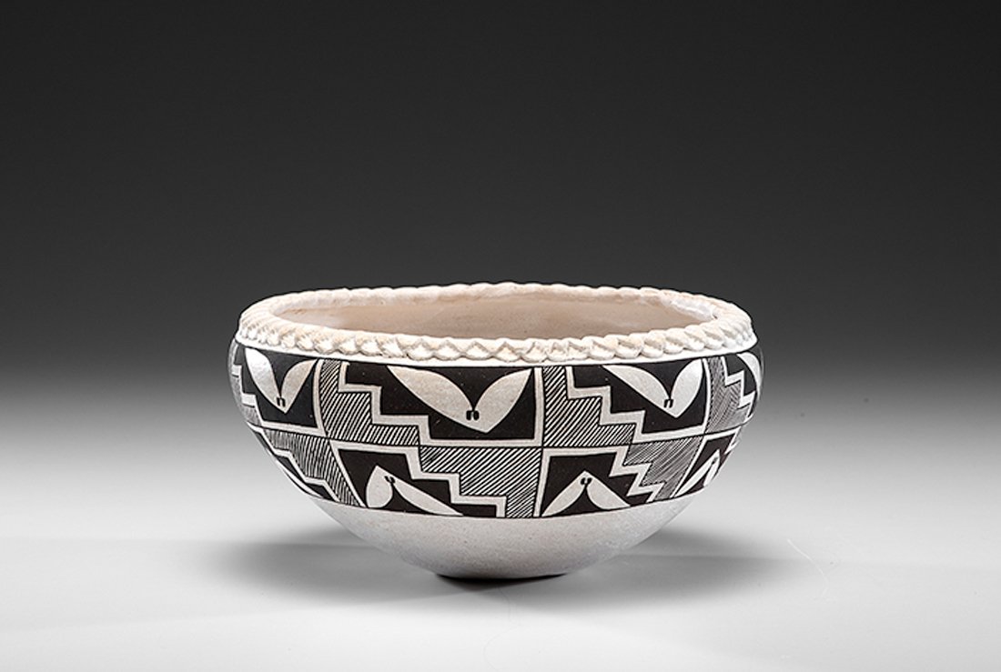 Lucy Lewis (Acoma, 1898-1992) Bowl Deaccessioned from a: Lucy Lewis (Acoma, 1898-1992) Bowl Deaccessioned from a Midwestern Museum titled 1968; large bowl decorated with stylized rainbirds and stepped triangles filled with hatch marks; piecrust rim; sig