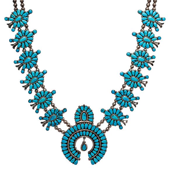 Warren Ondelacy (Zuni, 1895-1972) Attributed Cluster: Warren Ondelacy (Zuni, 1895-1972) Attributed Cluster Turquoise Squash Blossom Necklace unsigned and made with turquoise. Classic example with large naja set with 64 turquoise stones, length 32 in. m