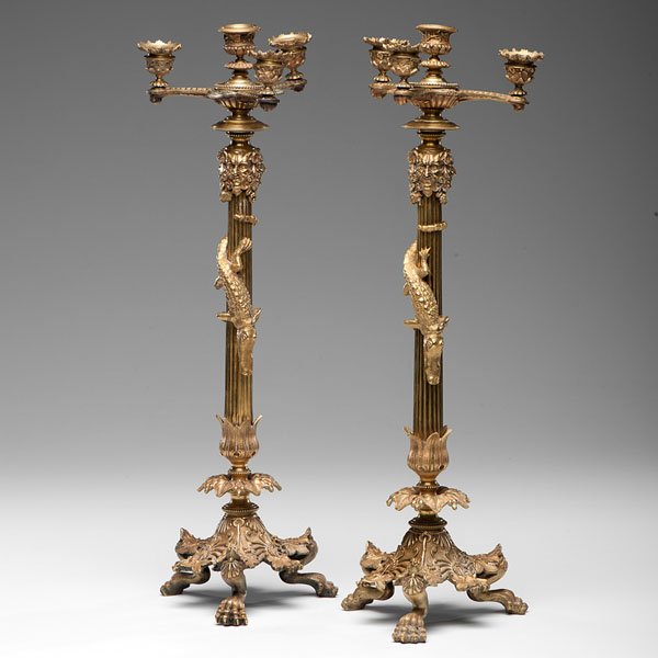 Pair of French Ormolu Candelabra : Pair of French Ormolu Candelabra French, early 20th century. A pair of ormolu candelabra with Bacchus relief, alligator figures on pillar and lion feet; ht. 23 in.