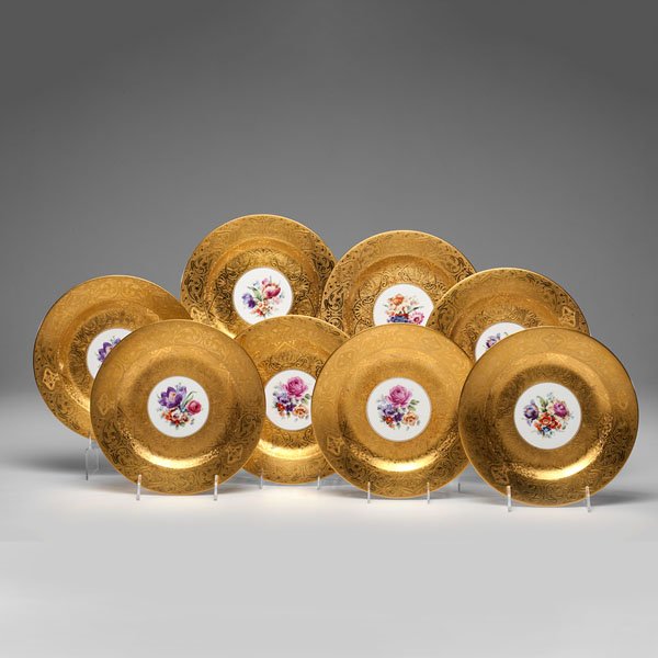 Bavarian Porcelain Service Plates : Bavarian Porcelain Service Plates Bavarian, 20th century. A set of eight service plates featuring low-relief gold rims and a circular central reserve featuring a painted floral arrangement, each st