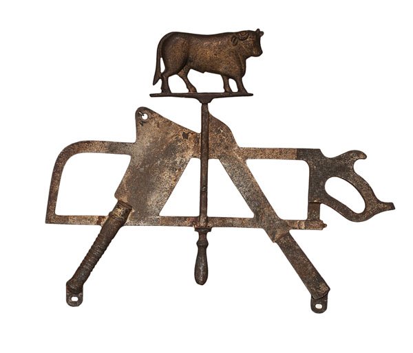 Butcher's Cast Iron Trade Sign : Butcher's Cast Iron Trade Sign American, late 19th-early 20th century. A cast iron butcher's trade sign, depicting a steer above a variety of butcher's tools including a saw, a cleaver, a knife, and