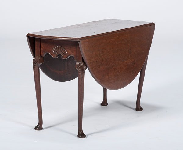 Queen Anne Drop Leaf Table : Queen Anne Drop Leaf Table English, 19th century. A Queen Anne-style drop leaf table in mahogany, on cabriole legs with scallop carved knees and pad feet; ht. 24, wd. 46.5, dp. 18.5 in. (closed).