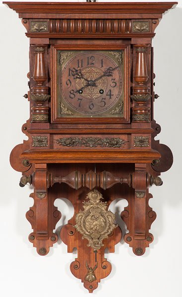 German Wall Clock : German Wall Clock German, early 20th century. An eight-day wall clock striking on two gongs by Lenskirch, the walnut case having turned columns and applied ormolu mounts, clock dial with Art Nouvea