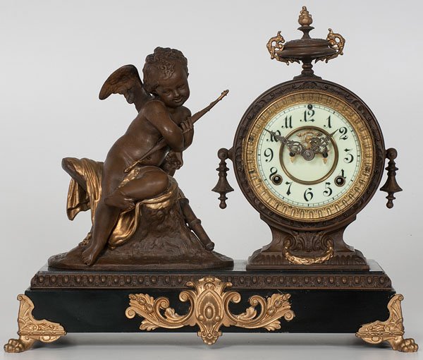 Figural Mantel Clock : Figural Mantel Clock Probably Ansonia, ca 1895. A figural mantel clock with an eight day time and strike on gong movement, housed in a white metal case with an iron base and adorned with a statue of