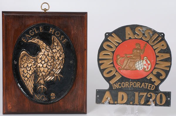Fire Marks : Fire Marks Two fire marks, one a cast iron eagle fire mark of oval form for Eagle Hose / No. 2, mounted on a wooden plaque, and the other a tin fire mark for London Assurance / Incorporated / A.D. 1