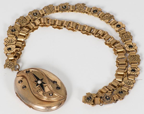 Civil War Era Book Chain : Civil War Era Book Chain American, mid-19th century. A gilt metal book chain with locket, decorated with enamel and reed pearls; lg. 11.25 in. (including locket). Note: The book chain, invented