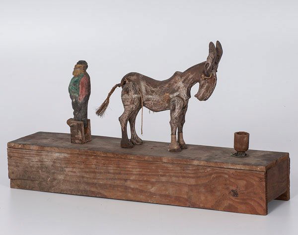 Kicking Donkey Mechanical Folk Art Whimsey : Kicking Donkey Mechanical Folk Art Whimsey American, 20th century. A carved and polychrome painted mechanical folk art whimsey in the form of a donkey kicking a man. The whimsey activates by moving
