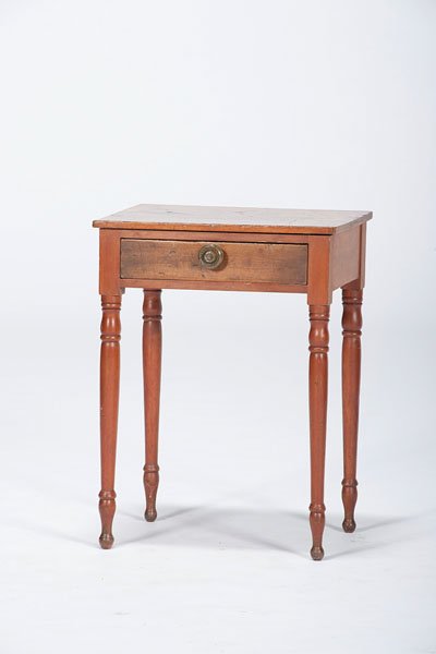 Sheraton-Style Side Table : Sheraton-Style Side Table American, 19th century. A side table in mixed woods featuring a one board top and single frieze drawer, rising on turned, tapering legs; ht. 28.75, wd. 21.25, dp. 15.5 in.